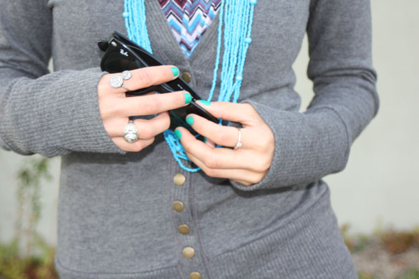 gray-sweater-closeup-rayban-turquoise-necklace
